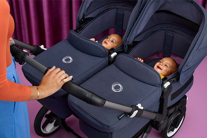 Two babies in twin stroller